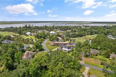 Nestled on a corner lot in the sought-after Oak Grove Island on Oak Grove Island Golf and Country Club in Georgia - for sale on GolfHomes.com, golf home, golf lot