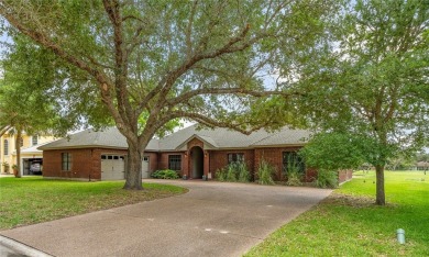 Elegant all-brick that overlooks a pond, Rockport golf course on Rockport Country Club in Texas - for sale on GolfHomes.com, golf home, golf lot