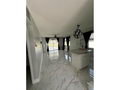 Beautifully Upgraded 2nd floor 2bedroom 2 Bath condo. Corner on Leisureville Community Association in Florida - for sale on GolfHomes.com, golf home, golf lot