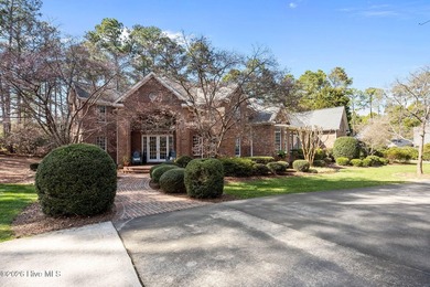 This gorgeous golf front home sits on two lots in a peaceful on Pinewild Country Club of Pinehurst in North Carolina - for sale on GolfHomes.com, golf home, golf lot