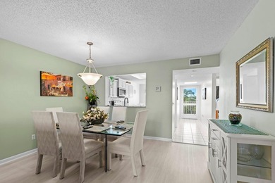 ABSOLUTELY GORGEOUS WATERFRONT 4TH FLOOR CONDO | PRESTIGIOUS 55+ on Fountains Golf and Country Club in Florida - for sale on GolfHomes.com, golf home, golf lot