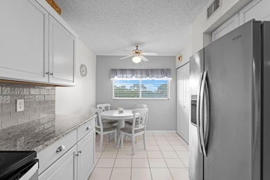 ABSOLUTELY GORGEOUS WATERFRONT 4TH FLOOR CONDO | PRESTIGIOUS 55+ on Fountains Golf and Country Club in Florida - for sale on GolfHomes.com, golf home, golf lot