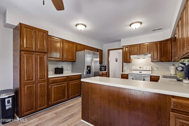 This home is situated on an expansive 3/4-acre homesite in one on Carolina Shores Golf Course in North Carolina - for sale on GolfHomes.com, golf home, golf lot