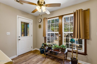 This home is situated on an expansive 3/4-acre homesite in one on Carolina Shores Golf Course in North Carolina - for sale on GolfHomes.com, golf home, golf lot