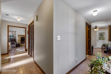 This home is situated on an expansive 3/4-acre homesite in one on Carolina Shores Golf Course in North Carolina - for sale on GolfHomes.com, golf home, golf lot