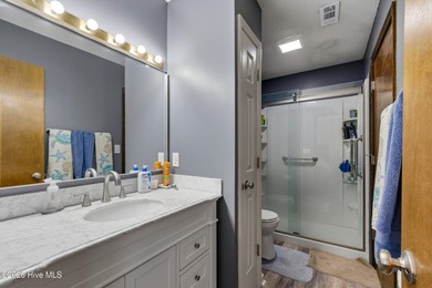 This home is situated on an expansive 3/4-acre homesite in one on Carolina Shores Golf Course in North Carolina - for sale on GolfHomes.com, golf home, golf lot