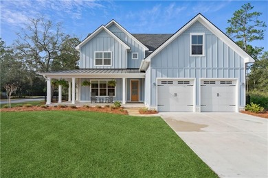Welcome to this beautiful coastal-style home, tucked away in the on The Golf Club At Sanctuary Cove in Georgia - for sale on GolfHomes.com, golf home, golf lot