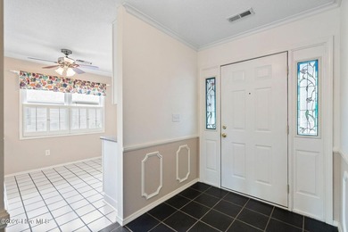 Welcome to this lovely, well-kept three-bedroom, two-bathroom on Olde Point Golf and Country Club in North Carolina - for sale on GolfHomes.com, golf home, golf lot