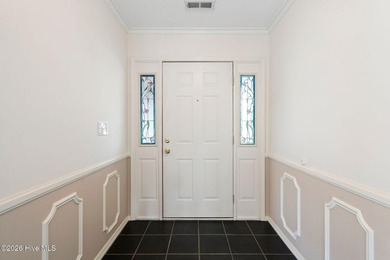 Welcome to this lovely, well-kept three-bedroom, two-bathroom on Olde Point Golf and Country Club in North Carolina - for sale on GolfHomes.com, golf home, golf lot