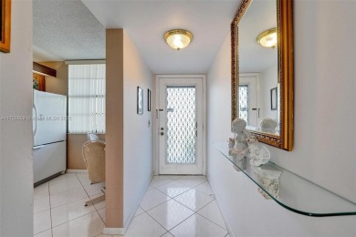 This 2 bedroom 2 bathroom 4th floor condo overlooking the golf on Pine Island Ridge Country Club in Florida - for sale on GolfHomes.com, golf home, golf lot