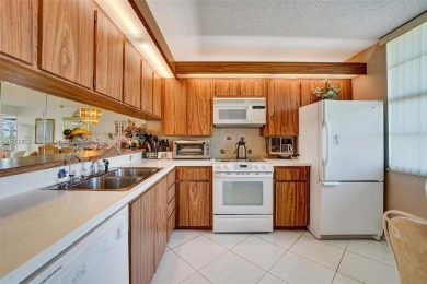 This 2 bedroom 2 bathroom 4th floor condo overlooking the golf on Pine Island Ridge Country Club in Florida - for sale on GolfHomes.com, golf home, golf lot