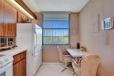 This 2 bedroom 2 bathroom 4th floor condo overlooking the golf on Pine Island Ridge Country Club in Florida - for sale on GolfHomes.com, golf home, golf lot