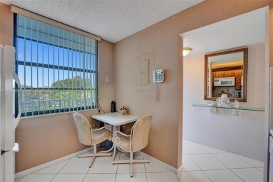 This 2 bedroom 2 bathroom 4th floor condo overlooking the golf on Pine Island Ridge Country Club in Florida - for sale on GolfHomes.com, golf home, golf lot