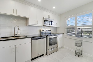 Wake up to serene marina views from your own patio in the heart on North Palm Beach Country Club in Florida - for sale on GolfHomes.com, golf home, golf lot