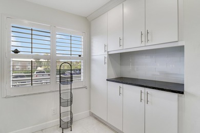 Wake up to serene marina views from your own patio in the heart on North Palm Beach Country Club in Florida - for sale on GolfHomes.com, golf home, golf lot