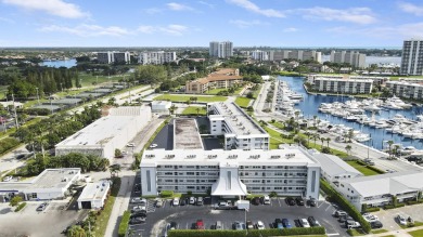Wake up to serene marina views from your own patio in the heart on North Palm Beach Country Club in Florida - for sale on GolfHomes.com, golf home, golf lot