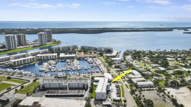 Wake up to serene marina views from your own patio in the heart on North Palm Beach Country Club in Florida - for sale on GolfHomes.com, golf home, golf lot