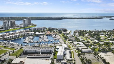 Wake up to serene marina views from your own patio in the heart on North Palm Beach Country Club in Florida - for sale on GolfHomes.com, golf home, golf lot