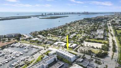 Wake up to serene marina views from your own patio in the heart on North Palm Beach Country Club in Florida - for sale on GolfHomes.com, golf home, golf lot