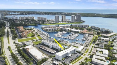 Wake up to serene marina views from your own patio in the heart on North Palm Beach Country Club in Florida - for sale on GolfHomes.com, golf home, golf lot
