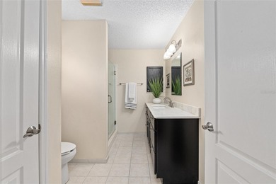 Nestled on a desirable corner homesite shaded by majestic live on Hacienda Hills Golf and Country Club in Florida - for sale on GolfHomes.com, golf home, golf lot