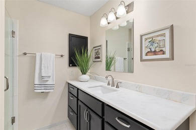 Nestled on a desirable corner homesite shaded by majestic live on Hacienda Hills Golf and Country Club in Florida - for sale on GolfHomes.com, golf home, golf lot