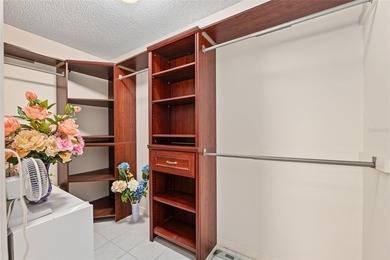 Nestled on a desirable corner homesite shaded by majestic live on Hacienda Hills Golf and Country Club in Florida - for sale on GolfHomes.com, golf home, golf lot