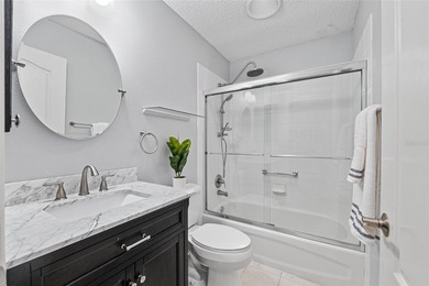 Nestled on a desirable corner homesite shaded by majestic live on Hacienda Hills Golf and Country Club in Florida - for sale on GolfHomes.com, golf home, golf lot