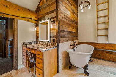 Set on 14 pristine acres along the Swan River, 2717 Tiger Road on Breckenridge Golf Club in Colorado - for sale on GolfHomes.com, golf home, golf lot