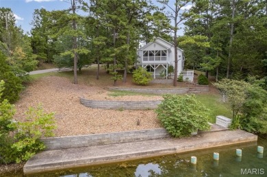 Lakefront living in Terre Du Lac! This brick and stone accented on Terre Du Lac Golf and Country Club in Missouri - for sale on GolfHomes.com, golf home, golf lot
