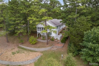 Lakefront living in Terre Du Lac! This brick and stone accented on Terre Du Lac Golf and Country Club in Missouri - for sale on GolfHomes.com, golf home, golf lot