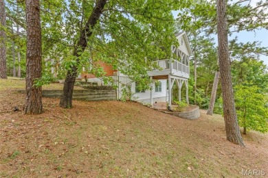 Lakefront living in Terre Du Lac! This brick and stone accented on Terre Du Lac Golf and Country Club in Missouri - for sale on GolfHomes.com, golf home, golf lot