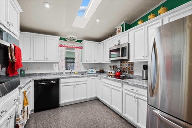 Escape the cold and embrace effortless Florida living in this on Betmar Acres Golf Club in Florida - for sale on GolfHomes.com, golf home, golf lot