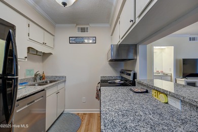 Downtown Calabash! This first-floor furnished condo has been on Carolina Shores Golf Course in North Carolina - for sale on GolfHomes.com, golf home, golf lot