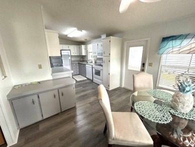 This clean and cozy 2-bedroom, 2-bathroom home offers a on Crystal Lake Club in Florida - for sale on GolfHomes.com, golf home, golf lot