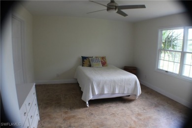14112 CLUBHOUSE DR BOKEELIA FL 33922 IS A 2 LARGE BEDROOM 2 BATH on Alden Pines Golf Club in Florida - for sale on GolfHomes.com, golf home, golf lot