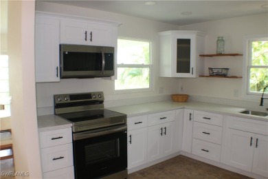 14112 CLUBHOUSE DR BOKEELIA FL 33922 IS A 2 LARGE BEDROOM 2 BATH on Alden Pines Golf Club in Florida - for sale on GolfHomes.com, golf home, golf lot