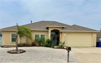 This beautiful Coquina Bay home was built in 2017 and is on Padre Isles Golf Course in Texas - for sale on GolfHomes.com, golf home, golf lot