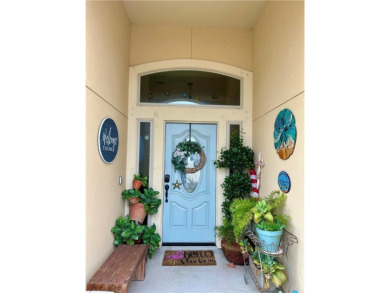 This beautiful Coquina Bay home was built in 2017 and is on Padre Isles Golf Course in Texas - for sale on GolfHomes.com, golf home, golf lot