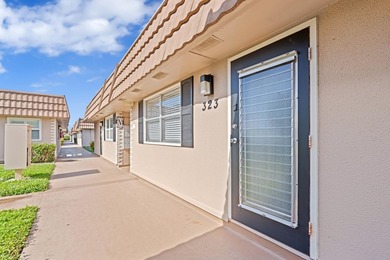 REMARKABLE FIRST-FLOOR CONDO | DESIRABLE 55+ KINGS POINT DELRAY on Kings Point Golf - Executive in Florida - for sale on GolfHomes.com, golf home, golf lot