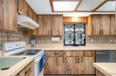 Discover this beautifully maintained 3-bedroom, 2-bathroom home on Sugarmill Woods Golf and Country Club in Florida - for sale on GolfHomes.com, golf home, golf lot