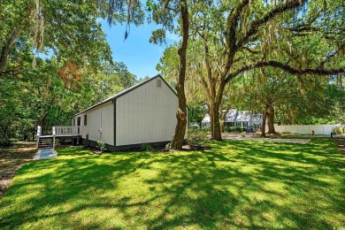 Nestled amidst the tranquil coastal beauty of Pawleys Island, SC on True Blue Plantation in South Carolina - for sale on GolfHomes.com, golf home, golf lot