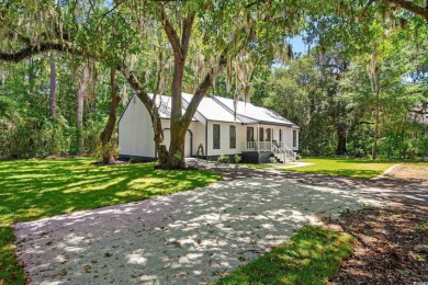 Nestled amidst the tranquil coastal beauty of Pawleys Island, SC on True Blue Plantation in South Carolina - for sale on GolfHomes.com, golf home, golf lot