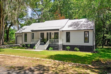 Nestled amidst the tranquil coastal beauty of Pawleys Island, SC on True Blue Plantation in South Carolina - for sale on GolfHomes.com, golf home, golf lot