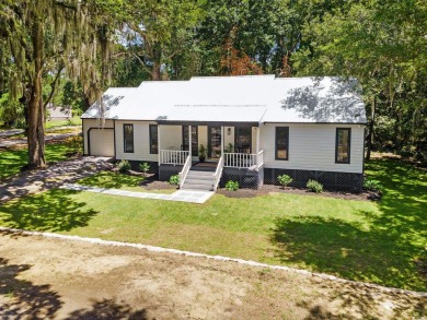 Nestled amidst the tranquil coastal beauty of Pawleys Island, SC on True Blue Plantation in South Carolina - for sale on GolfHomes.com, golf home, golf lot