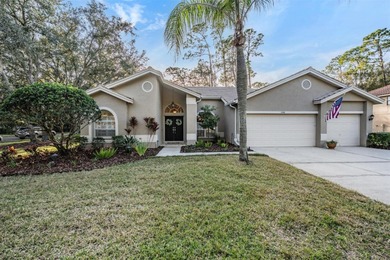 Set on an exceptional oversized wooded corner lot, nearly half on East Lake Woodlands Country Club in Florida - for sale on GolfHomes.com, golf home, golf lot