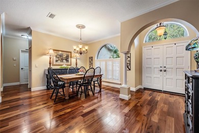Set on an exceptional oversized wooded corner lot, nearly half on East Lake Woodlands Country Club in Florida - for sale on GolfHomes.com, golf home, golf lot