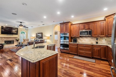 Set on an exceptional oversized wooded corner lot, nearly half on East Lake Woodlands Country Club in Florida - for sale on GolfHomes.com, golf home, golf lot