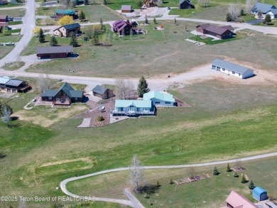Beautifully landscaped and ideally situated on the 11th fairway on Star Valley RV Golf Course in Wyoming - for sale on GolfHomes.com, golf home, golf lot