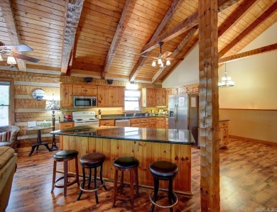 Discover your peaceful forest retreat in this inviting 3-bedroom on Cortez Golf Course in Arkansas - for sale on GolfHomes.com, golf home, golf lot